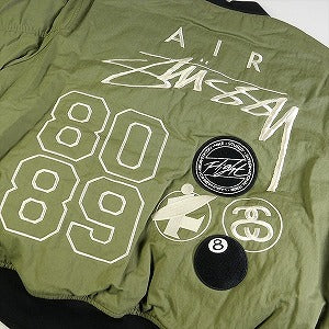 STUSSY ステューシー ×NIKE 23AW REVERSIBLE VARSITY JACKET MEDIUM OLIVE ジャケット オリーブ Size 【L】 【新古品・未使用品】 20807389